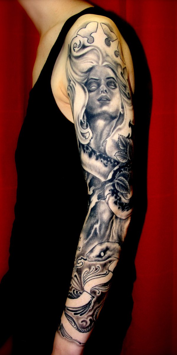 Artistic womens tatoo in gray