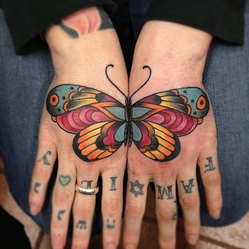 Beautiful butterfly matching tattoo on both hands