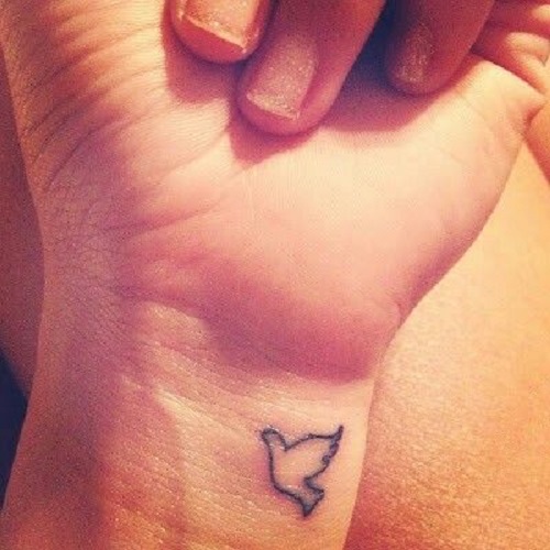 Bird tattoo on wrist