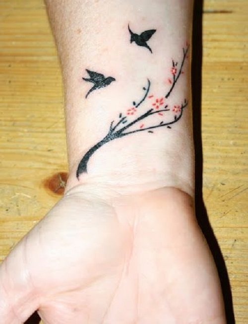 bird on branch tattoo