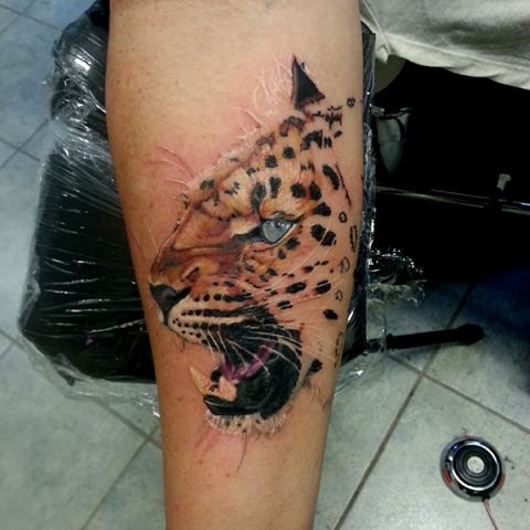 Colored cheetah on arm