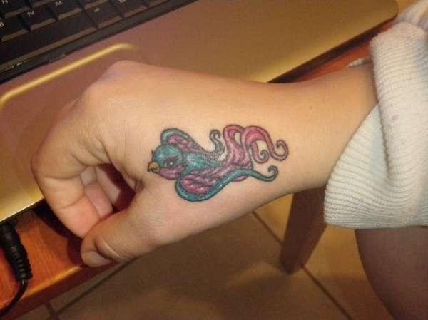 Colorful tattoo on hands