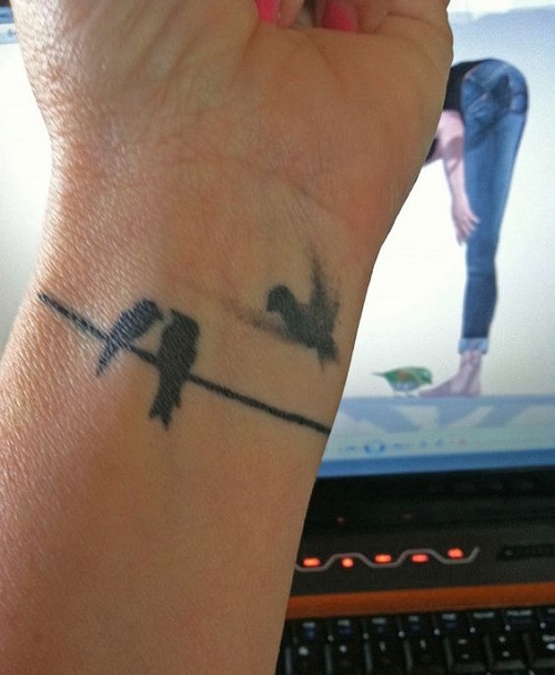 Lovebirds tattoo on wrist