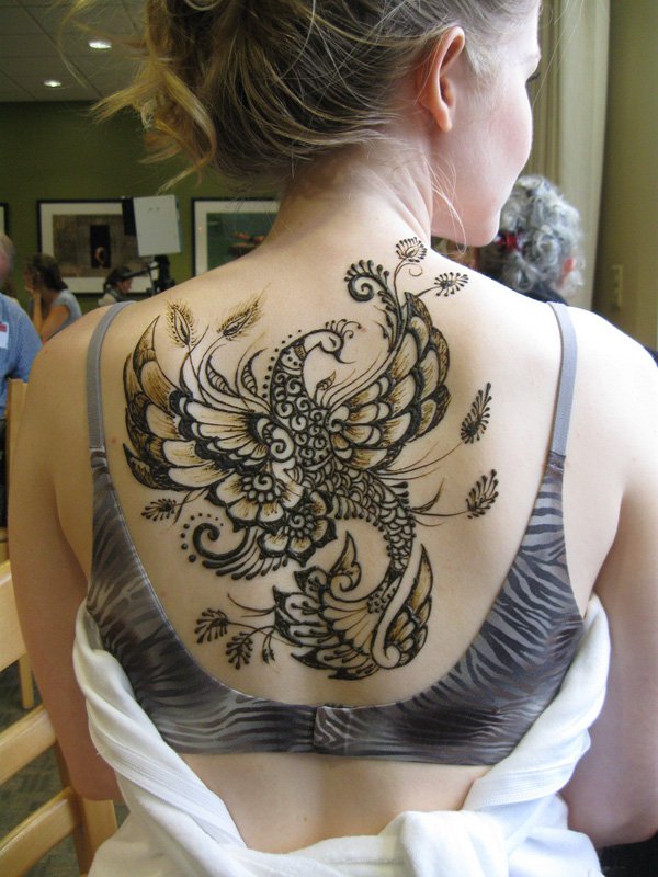 One color big artistic peacock on womens back