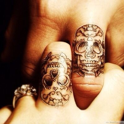 Skull ring finger married couple tattoos