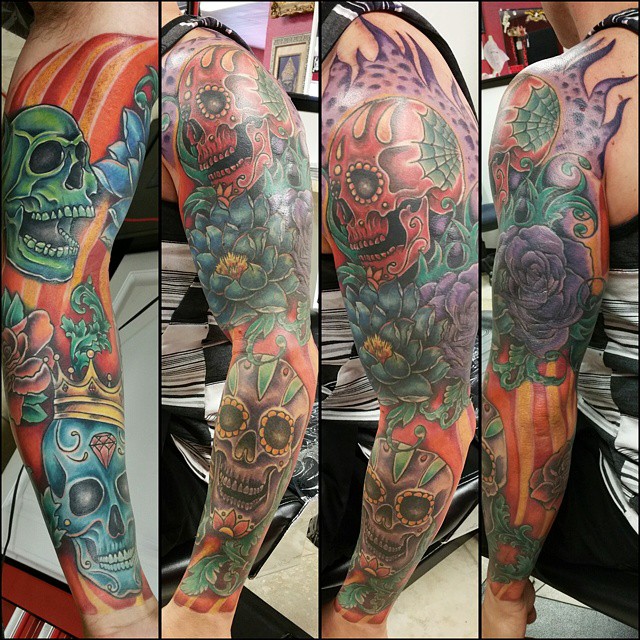 Skulls and flowers big colored tatoo