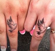 Three flying birds on the right middle finger