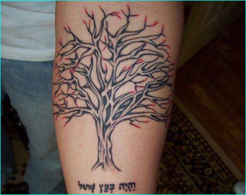 Tree and hebrew scripture tattoo