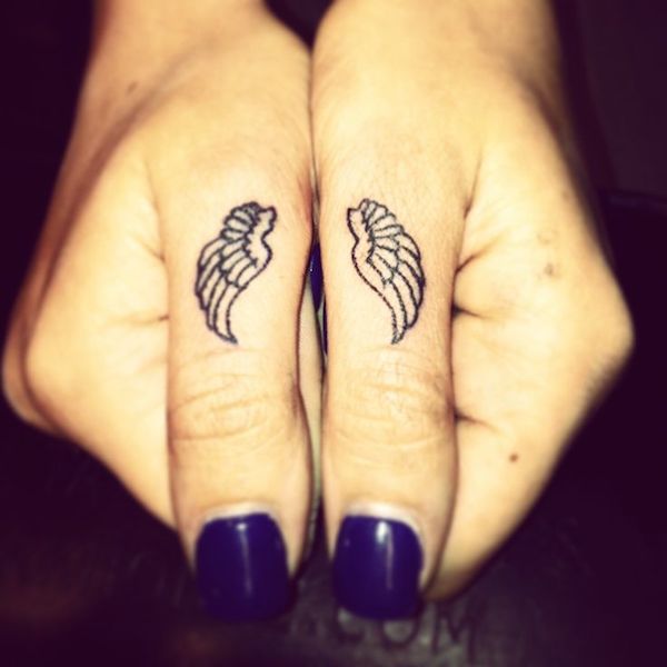 Wings finger tattoo