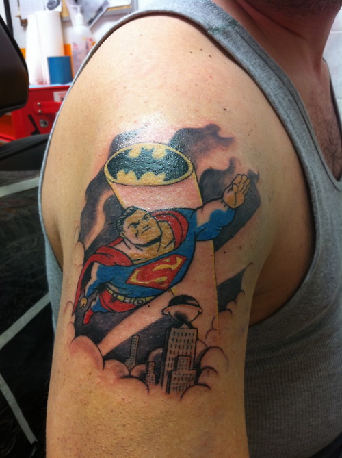 Batman vs superman cartoon on sholder - (Tattoo Pictures)(Tattoo Pictures)