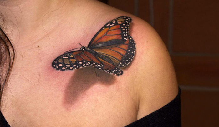 Big colored 3d butterfly on shoulder