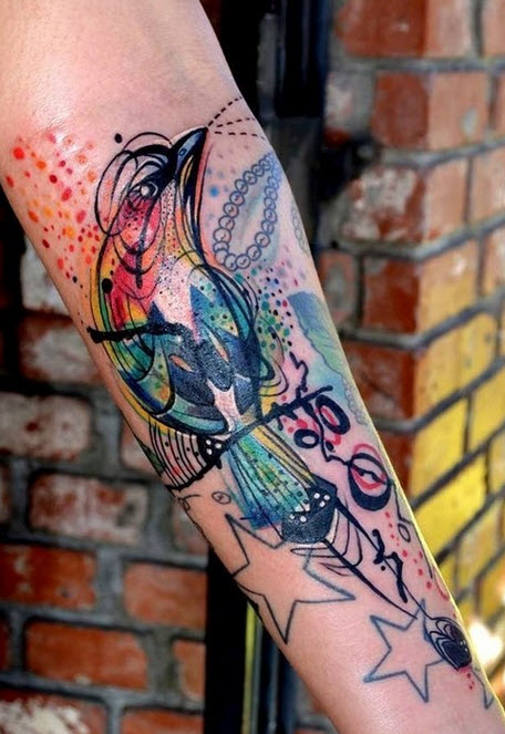 Big colored artistic swallow on hand