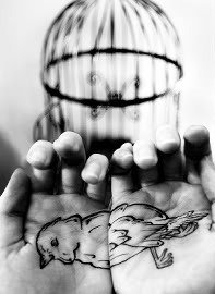 Bird in cage tatoo