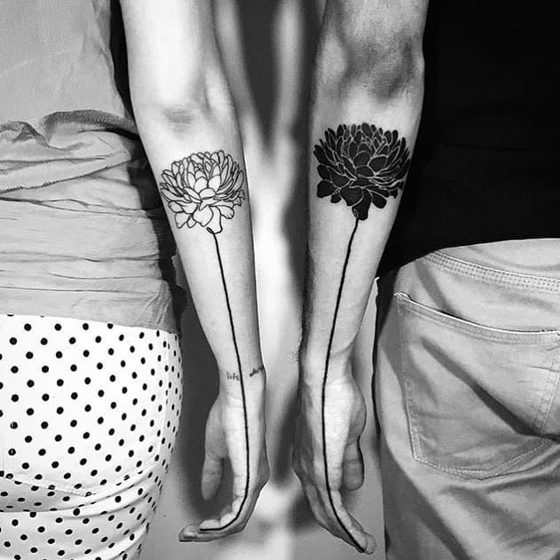Black and white rosses on arms