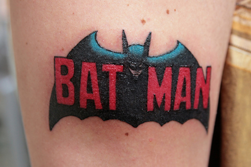 batman logo chest tattoo