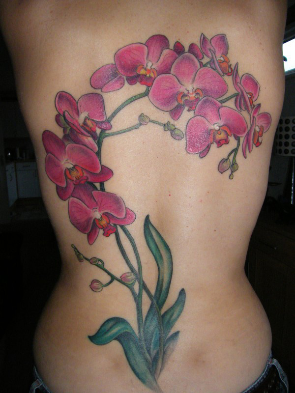 Colored lily flower tattoo