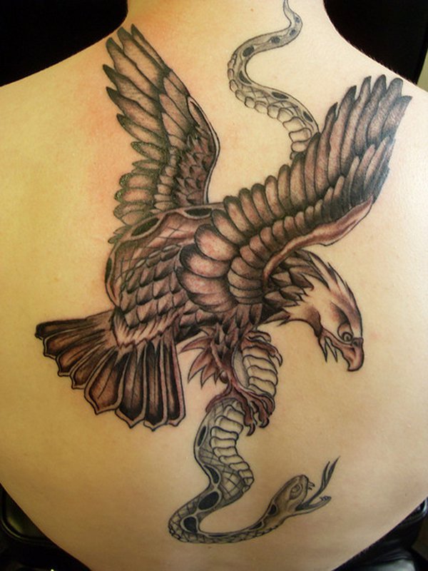 Colored big eagle catch the snake on womens back