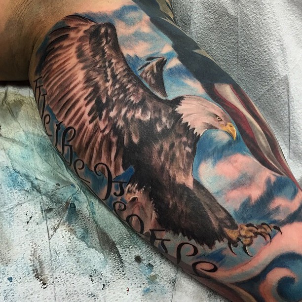 Colored big eagle strikes on mens hand