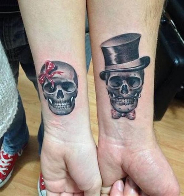 Couple matching skull tattoos