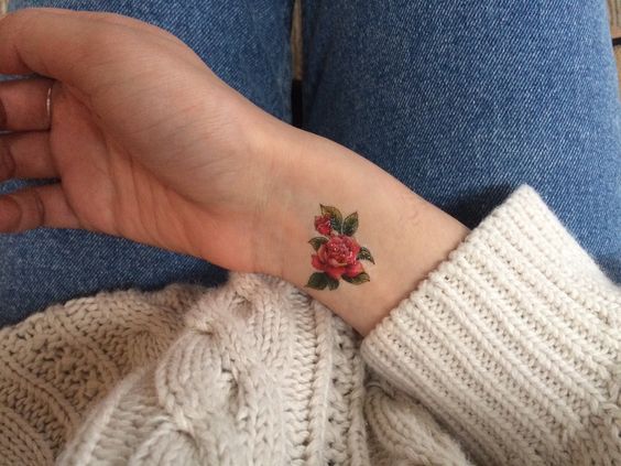 Cute red flower on arm