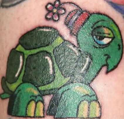 Cute small colored turtle cartoon tattoo