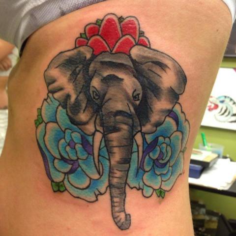 Elephant and flowers on shoulder in color