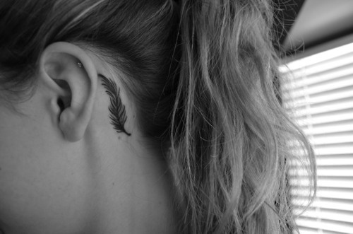 Feather behind the ear