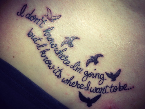 Flying birds and quote tattoo