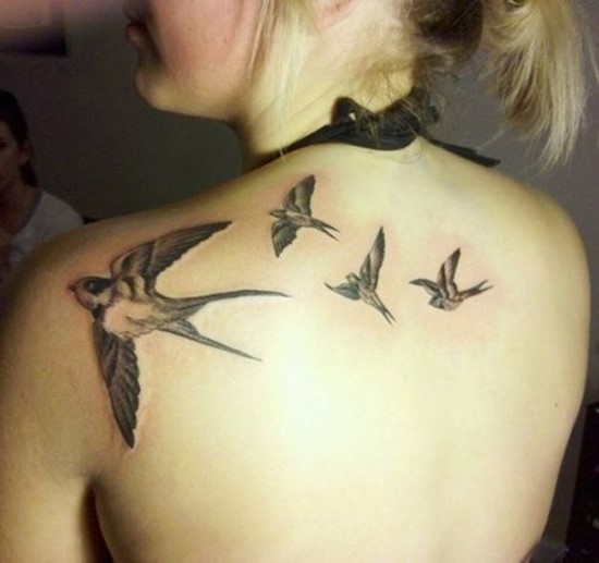 Four one color swallows on womens back