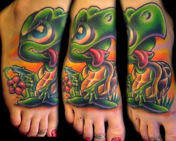 Full colored turtle cartoon tattoo on foot