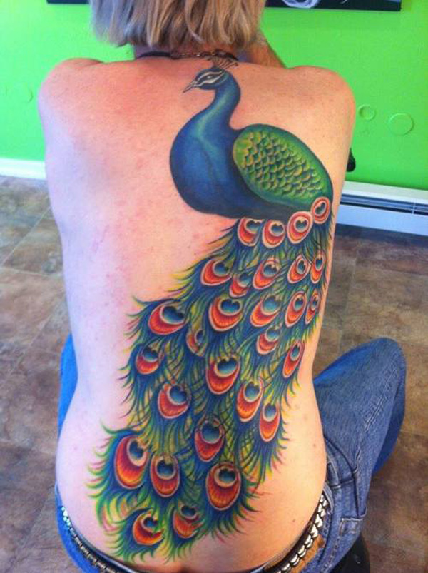 Full colored very long peacock on womens back