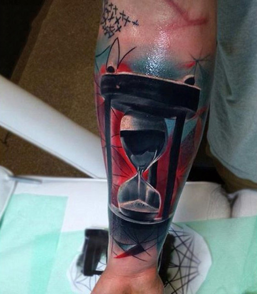 Graphical hour glass tattoo guys lower forearm