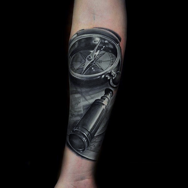 Grey colored compass realism tattoo mens forearms