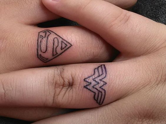 Him Her Matching Superman And Wonderwomen Finger Tattoos Tattoo Pictures Tattoo Pictures