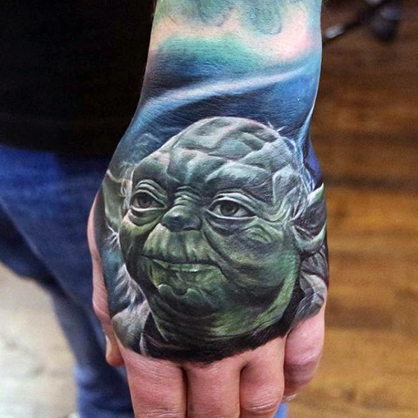 Male hands realistic alien face tattoo