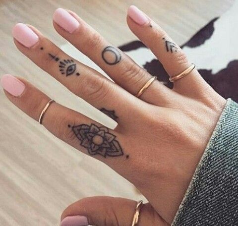 Mystical style finger tattoos