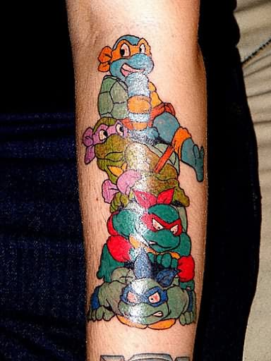 Njinja turtles cartoon tattoo on arm