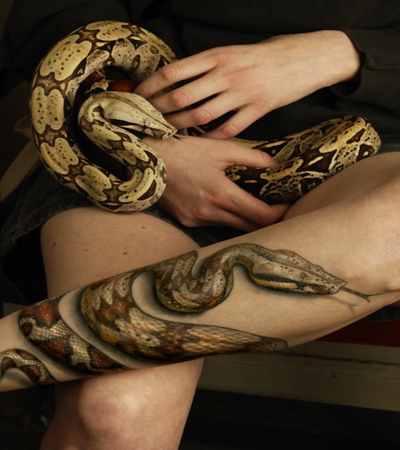 Realistic 3d snake on the leg