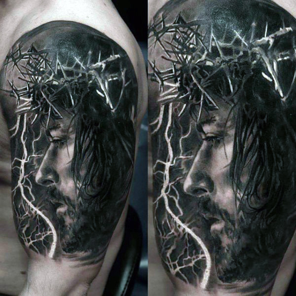 Realistic Jesus tattoo on male shoulders