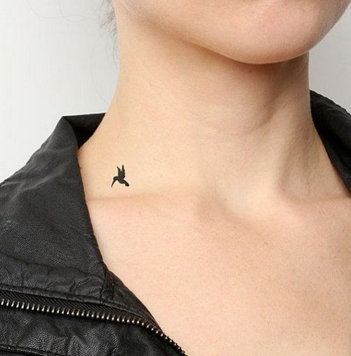 Small black bird tattoo on neckblack bird tattoo on neck