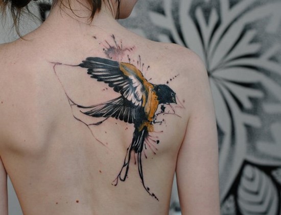 Watercolor big swallow on womens back